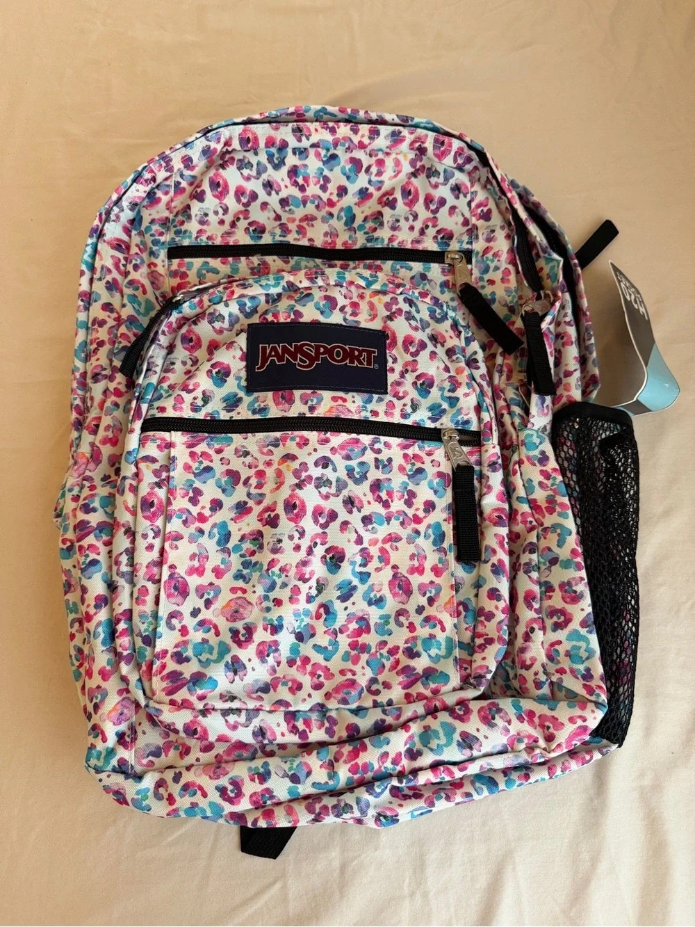 JanSport Backpack in White with Pink & Blue Leopard Print